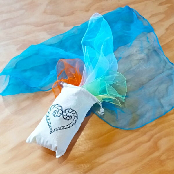 Set of assorted scarves in canvas heart bag