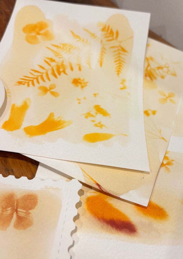 A yellow print of ferns and leaves